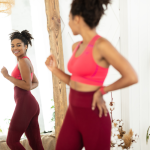 woman displaying Emsculpt weight loss results
