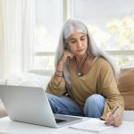 woman researching facelift and sofwave skin tightening in NoVA