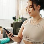 woman reading pre-treatment instructions for Emsculpt NEO