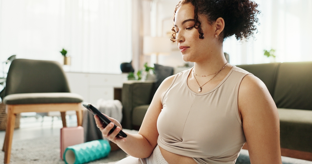 woman reading pre-treatment instructions for Emsculpt NEO