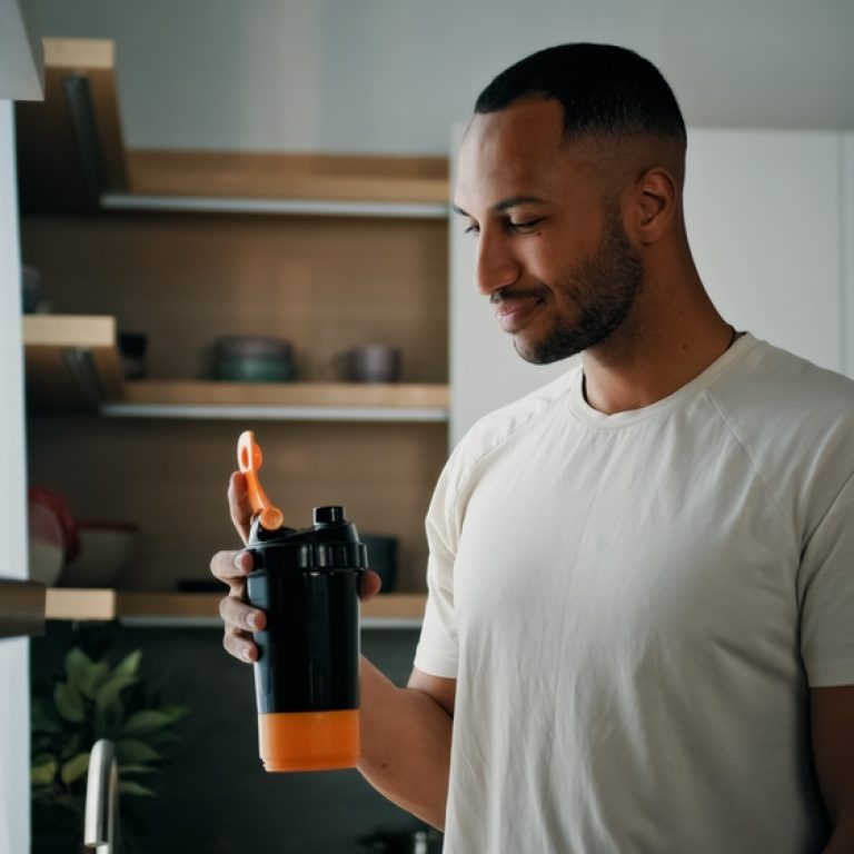 man reading Ultra Body Sculpt's Morpheus8 day-by-day recovery guide